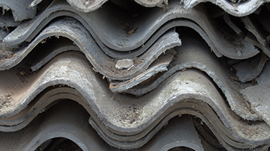 different colours and sizes of asbestos layered onto one another in a pile